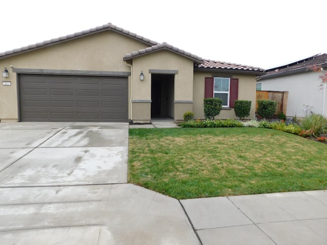 view of front of house with a garage and a front yard