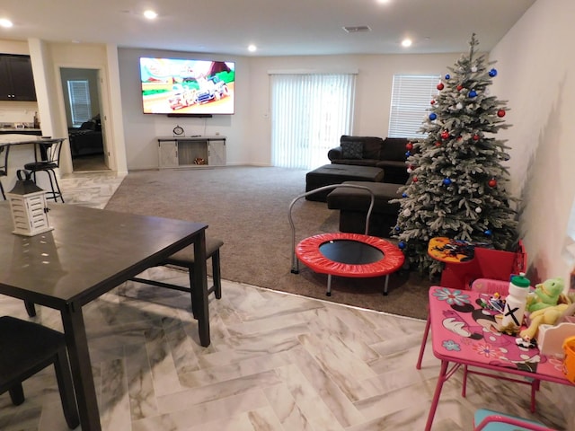 living room featuring light carpet