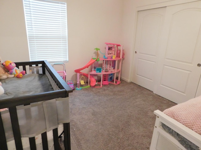 carpeted bedroom featuring a closet