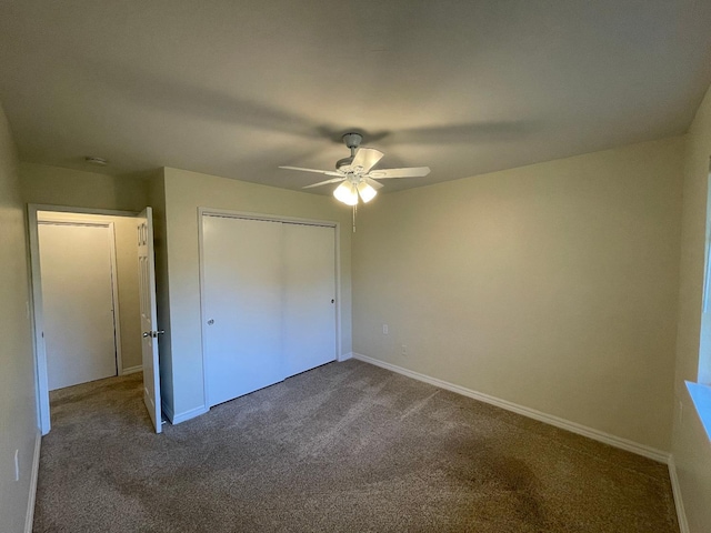 unfurnished bedroom featuring a closet, ceiling fan, and dark colored carpet