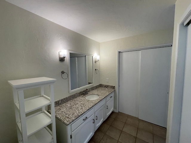 bathroom with vanity and tile patterned floors