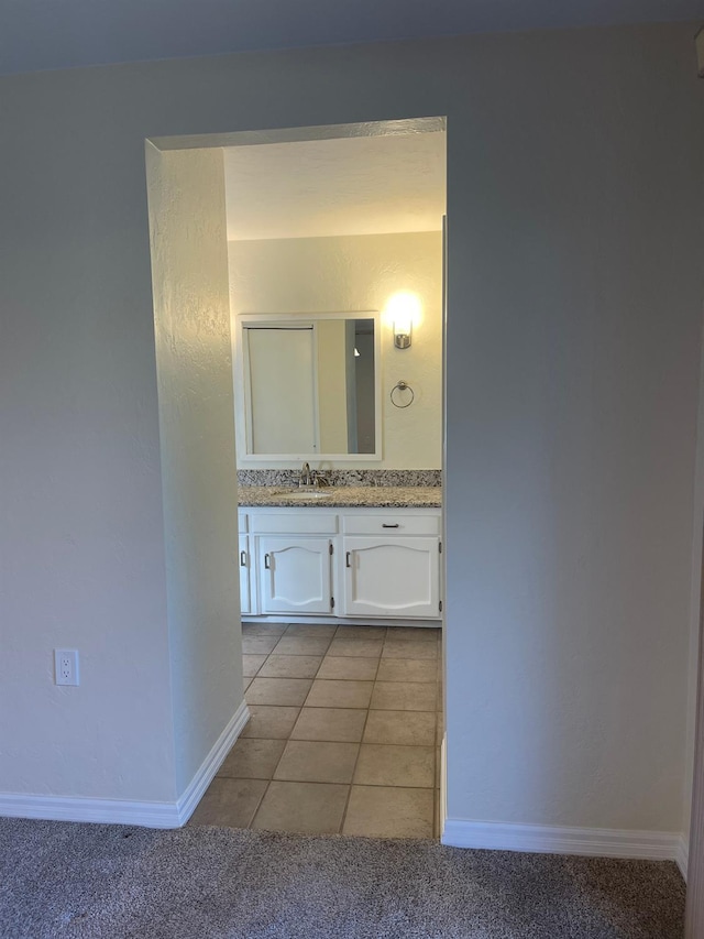 bathroom featuring tile patterned floors and vanity