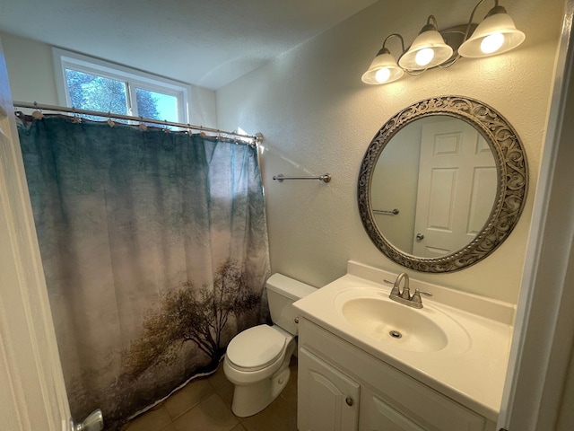 bathroom with toilet, vanity, tile patterned flooring, and a shower with curtain