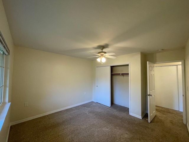 unfurnished bedroom with ceiling fan, a closet, and carpet