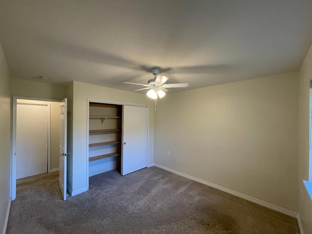 unfurnished bedroom featuring a closet, ceiling fan, and dark colored carpet