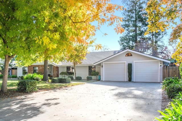 ranch-style home featuring a garage