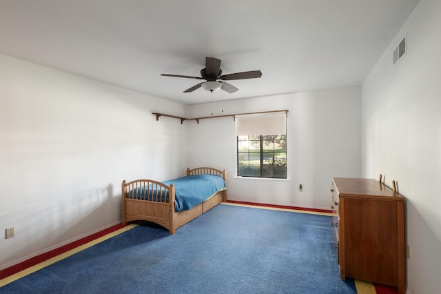 bedroom with dark carpet and ceiling fan