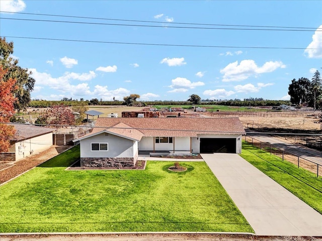 view of front of house with a front yard and a garage