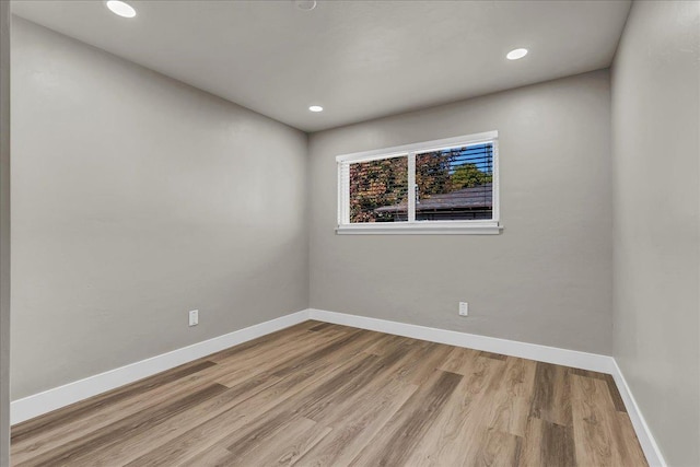 spare room featuring light hardwood / wood-style flooring