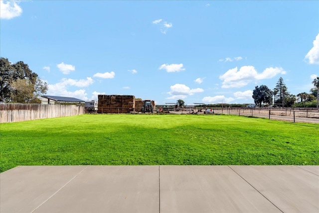 view of yard with a rural view