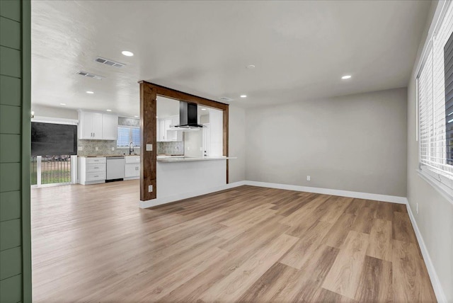 unfurnished living room featuring light hardwood / wood-style floors