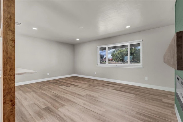 unfurnished living room with light hardwood / wood-style floors