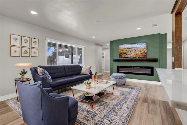 living room with light hardwood / wood-style flooring