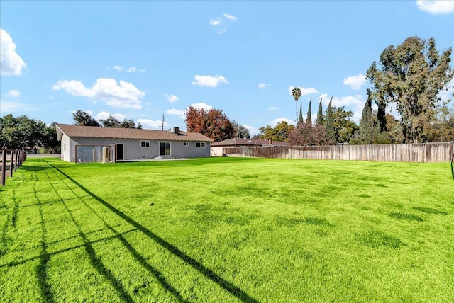 view of yard with a garage