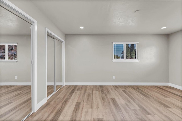 unfurnished bedroom featuring light wood-type flooring