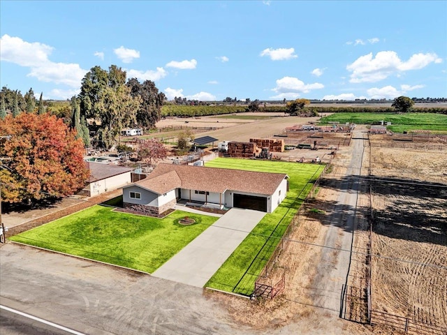 birds eye view of property with a rural view