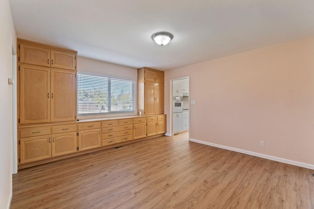 unfurnished bedroom featuring light hardwood / wood-style flooring