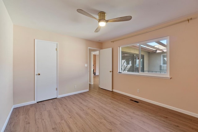 unfurnished bedroom with ceiling fan and light hardwood / wood-style flooring