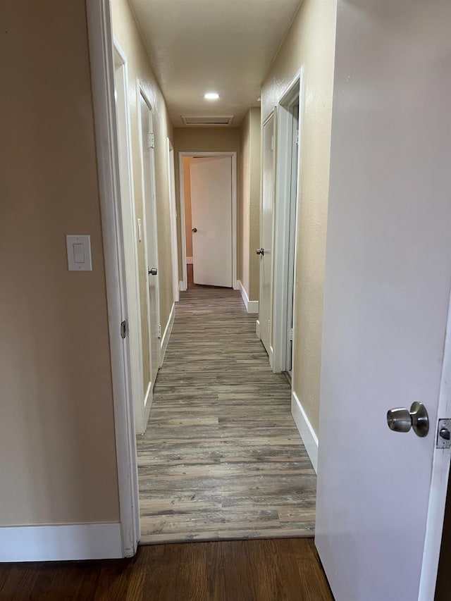 corridor featuring light hardwood / wood-style floors