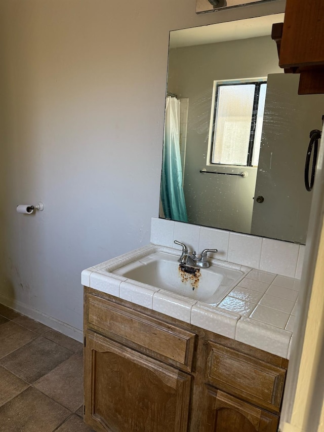 bathroom featuring vanity and tile patterned flooring