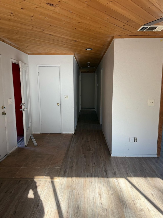 hall with dark wood-type flooring and wooden ceiling