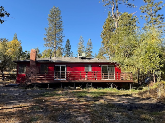 rear view of house with a wooden deck