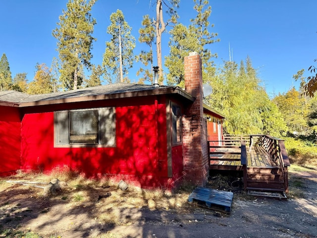 view of side of home featuring a deck