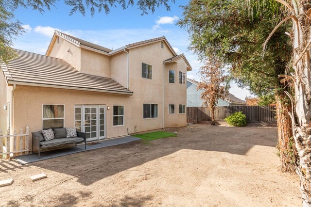 back of house featuring a patio