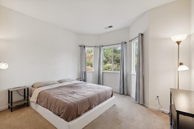 bedroom with light carpet