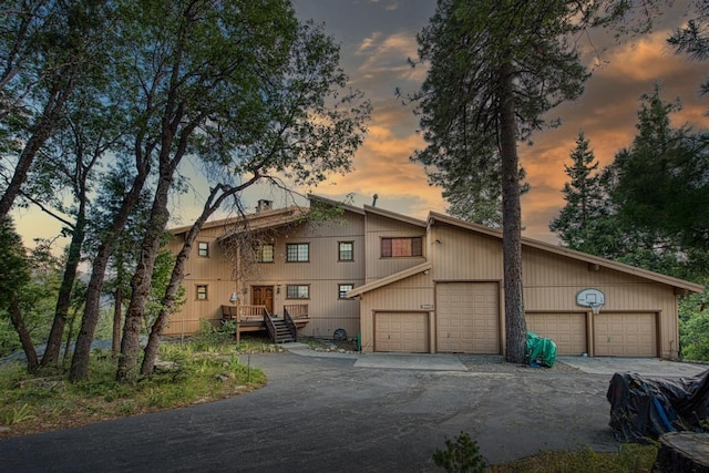 view of front of home with a garage and a deck