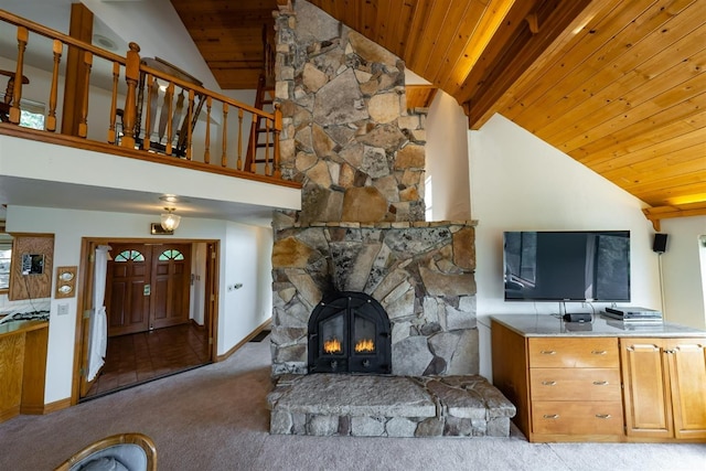 52180 Chahlip Ln, Shaver Lake, CA 93664 - living area featuring wooden ceiling with exposed beams, carpet floors, a fireplace, and high vaulted ceiling