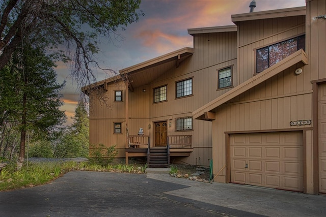 52180 Chahlip Ln, Shaver Lake, CA 93664 - back of house at dusk with a garage