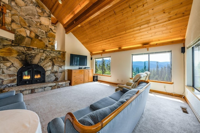 carpeted living room with beamed ceiling, wooden ceiling, a fireplace, and high vaulted ceiling