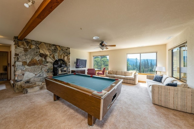 52180 Chahlip Ln, Shaver Lake, CA 93664 - playroom featuring carpet, a wood stove, ceiling fan, beam ceiling, and billiards table