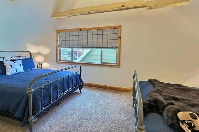 bedroom with carpet flooring and baseboards