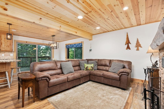 living area with recessed lighting, wooden ceiling, a notable chandelier, and light wood-style flooring