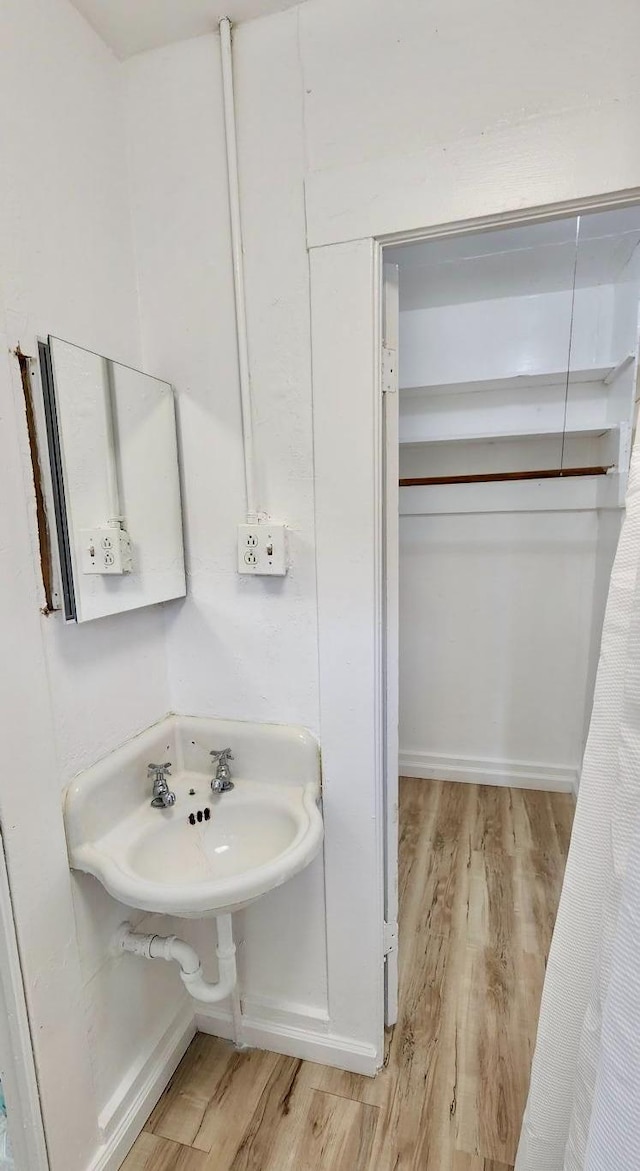 bathroom featuring hardwood / wood-style flooring and sink