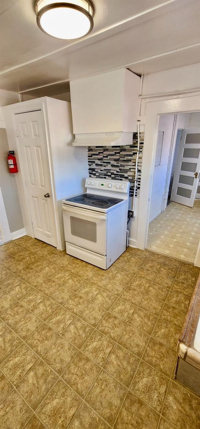 kitchen featuring decorative backsplash and white electric range