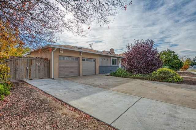 view of side of property featuring a garage