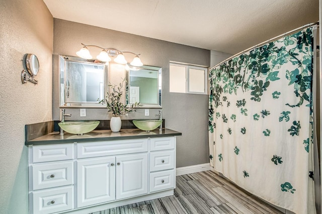 bathroom featuring vanity, a shower with curtain, and wood-type flooring