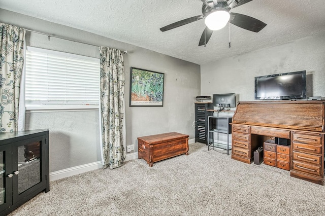 office area with ceiling fan, light colored carpet, and a textured ceiling