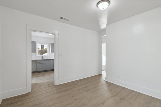 spare room with light wood-type flooring