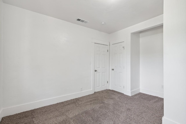 spare room featuring carpet floors