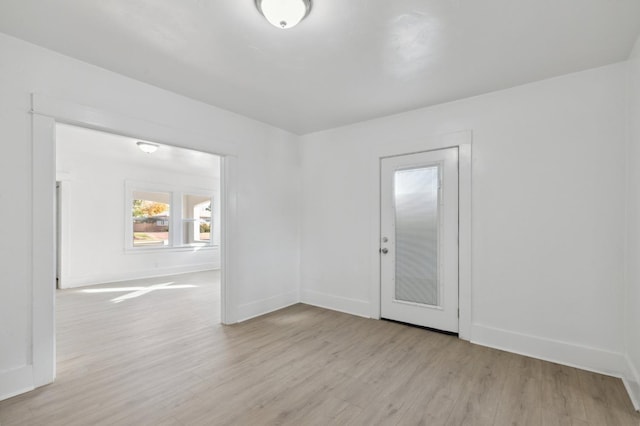 spare room with light hardwood / wood-style floors