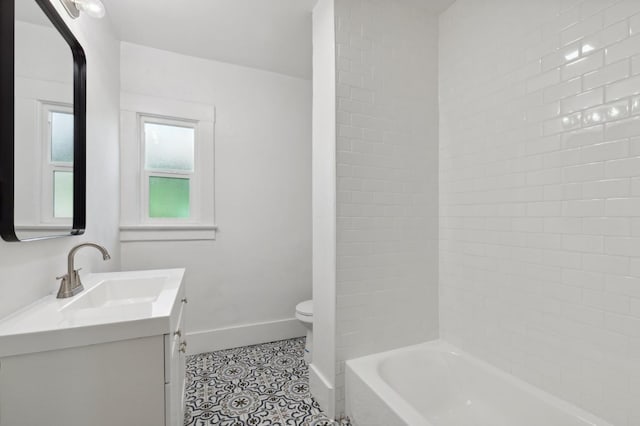 bathroom featuring tile patterned flooring, vanity, and toilet