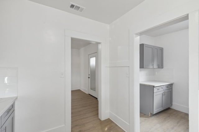 hallway featuring light hardwood / wood-style flooring