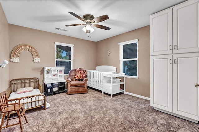 carpeted bedroom featuring ceiling fan