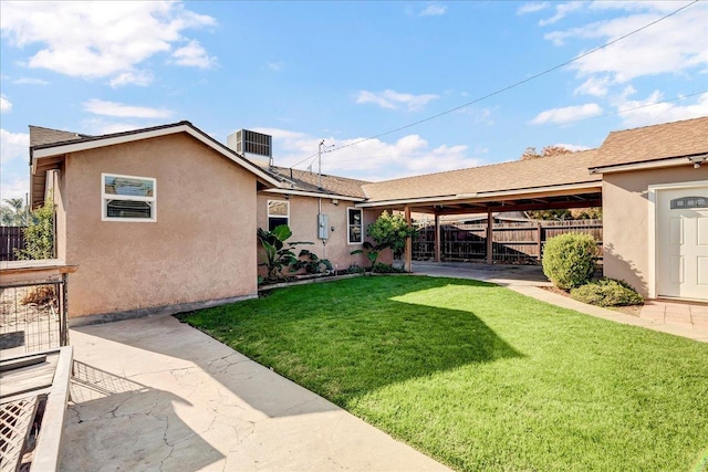 view of yard featuring cooling unit and a patio area