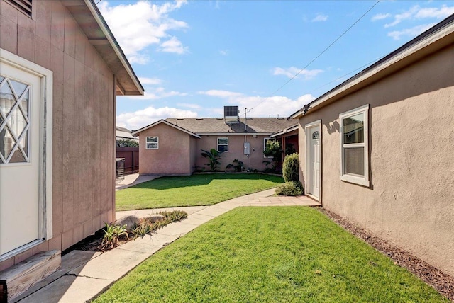 view of yard featuring central AC