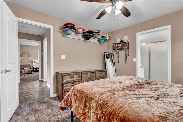 bedroom with ceiling fan and dark carpet